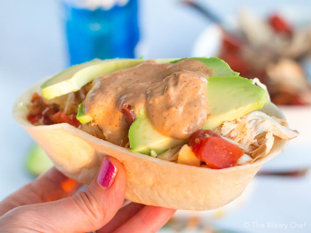 You'll love these fun Slow Cooker Chicken Tacos. They only need a few ingredients and are a perfect family dinner!