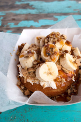 Granny's Pie topped with bananas, nuts and caramel at Gourdough's in Austin, Texas