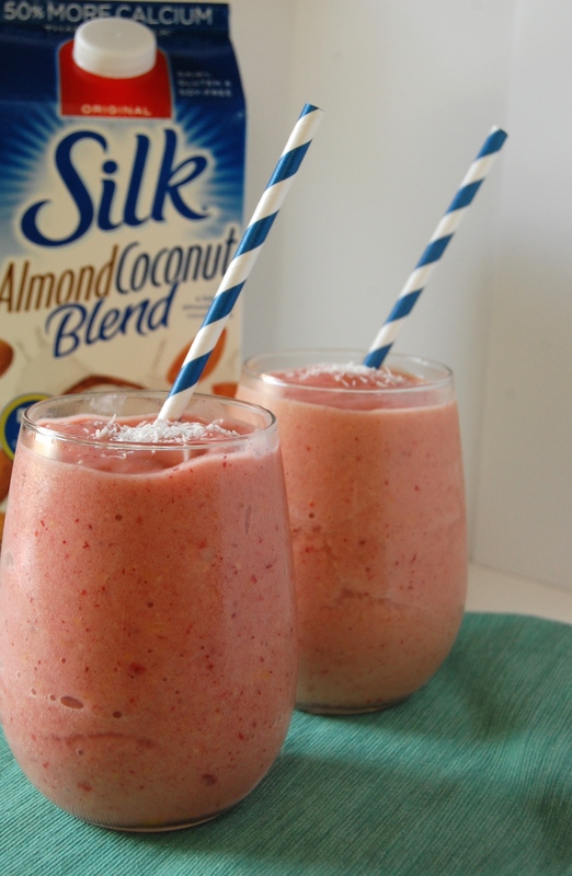 Mango Coconut Island Bliss 2 A vibrant glass of Tropical Almond Coconut Mango Smoothie garnished with fresh fruit