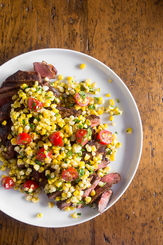 Grilled London Broil with Corn Salsa on a plate. 