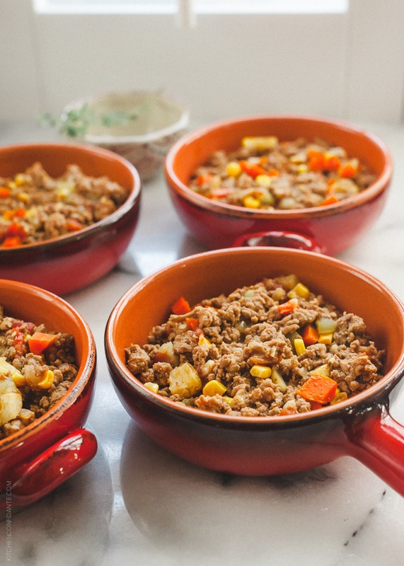 Four individual dishes of shepherd's pie.